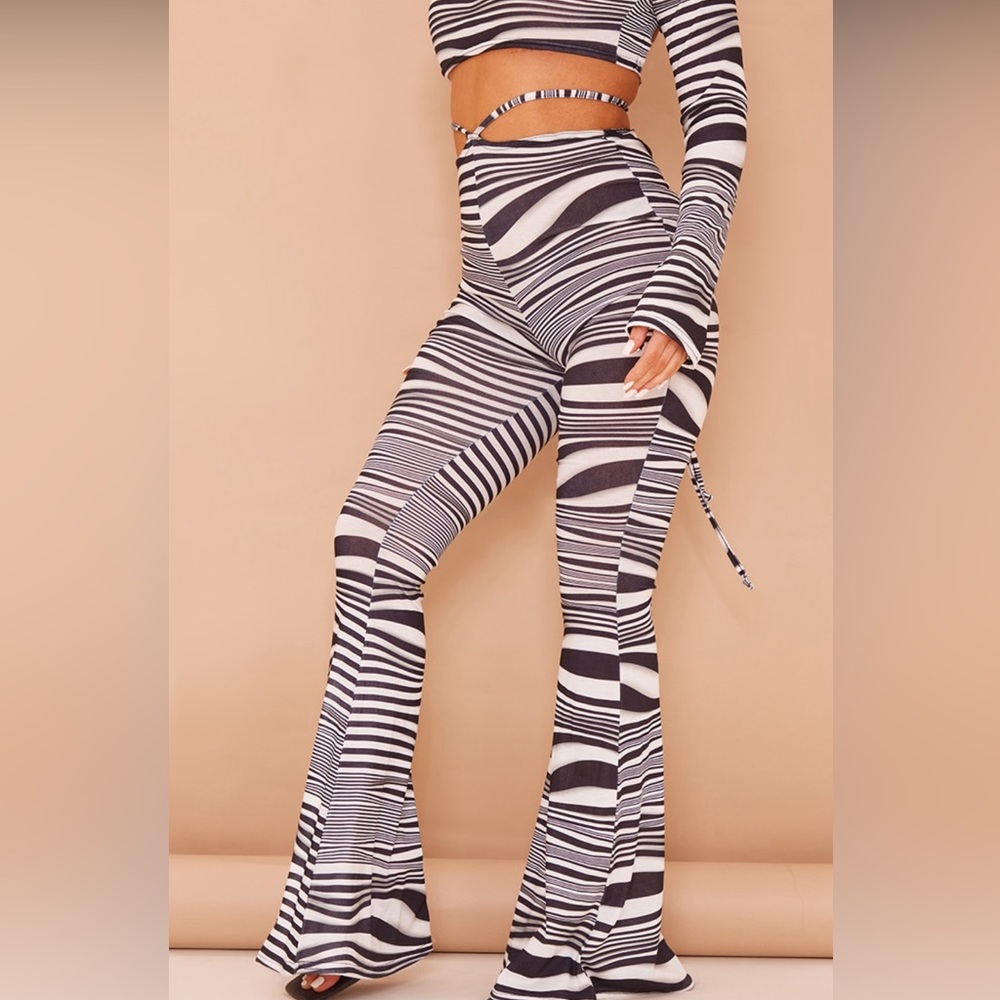 Black wave print long sleeve top and tie waist flare bottoms
